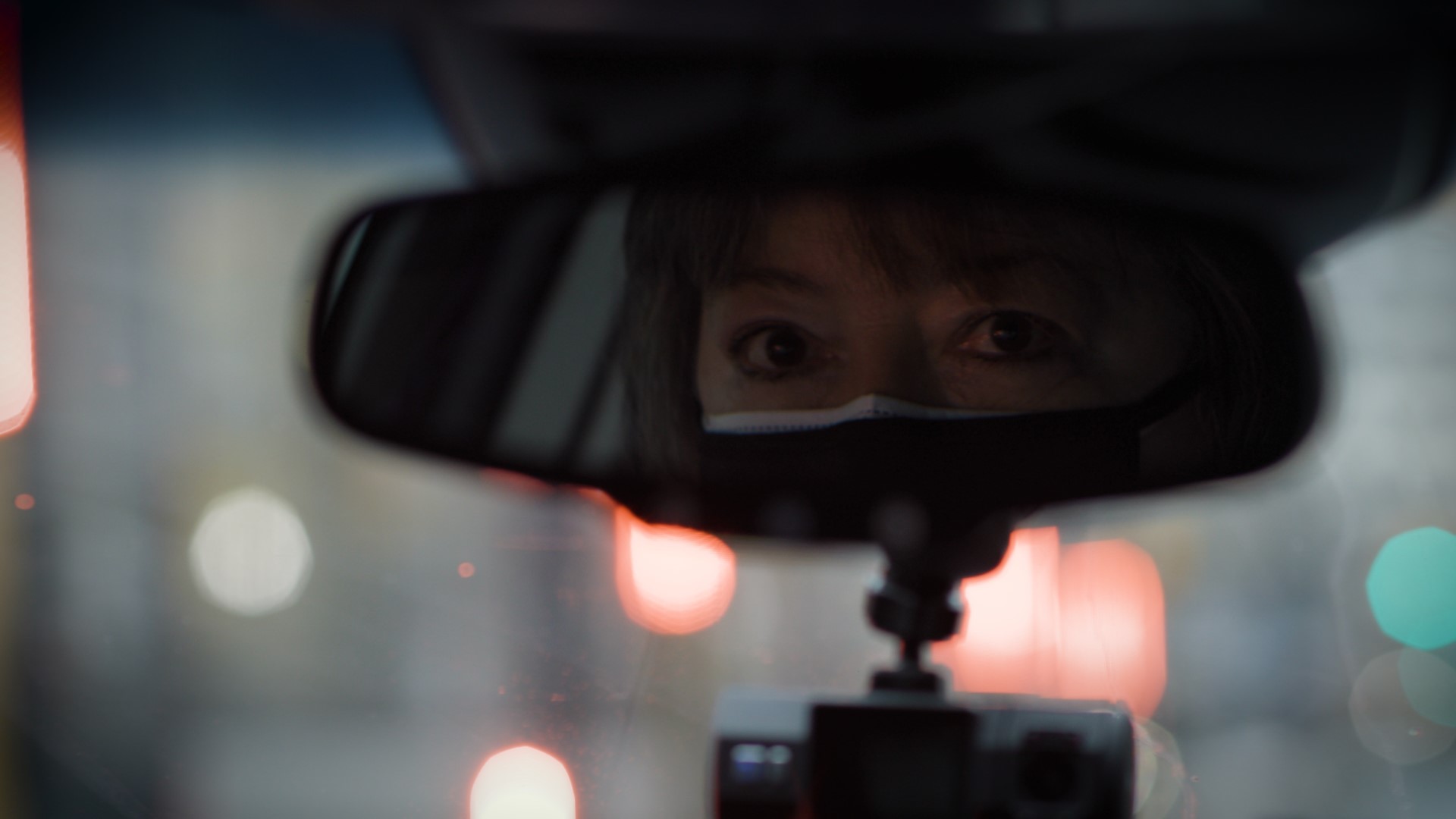 Woman in rearview mirror